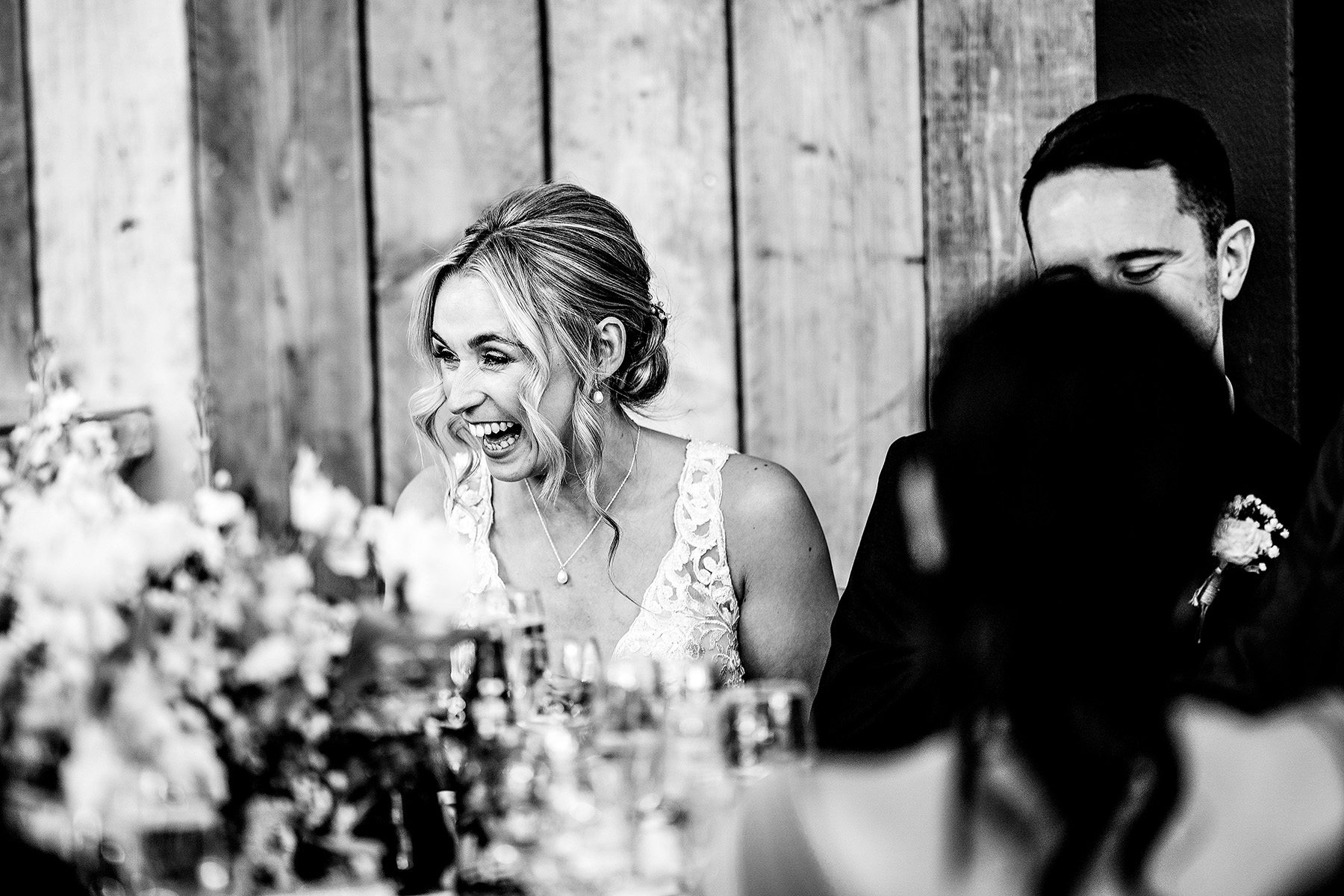 Bride smiling and laughing during the meal