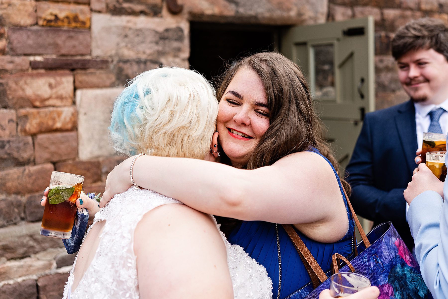 A big hug from a guest at a Wedding
