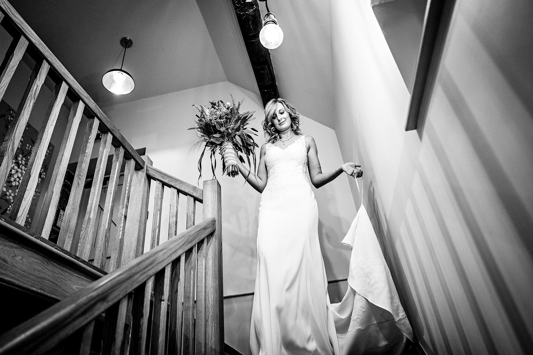 the bride walks down the stairs
