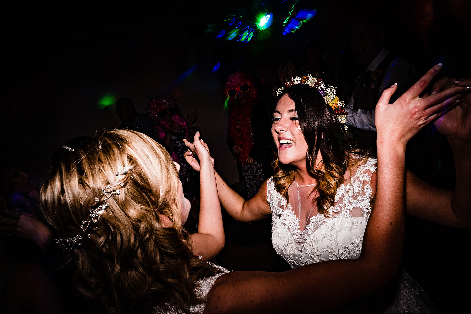 the two brides getting down on the dance floor