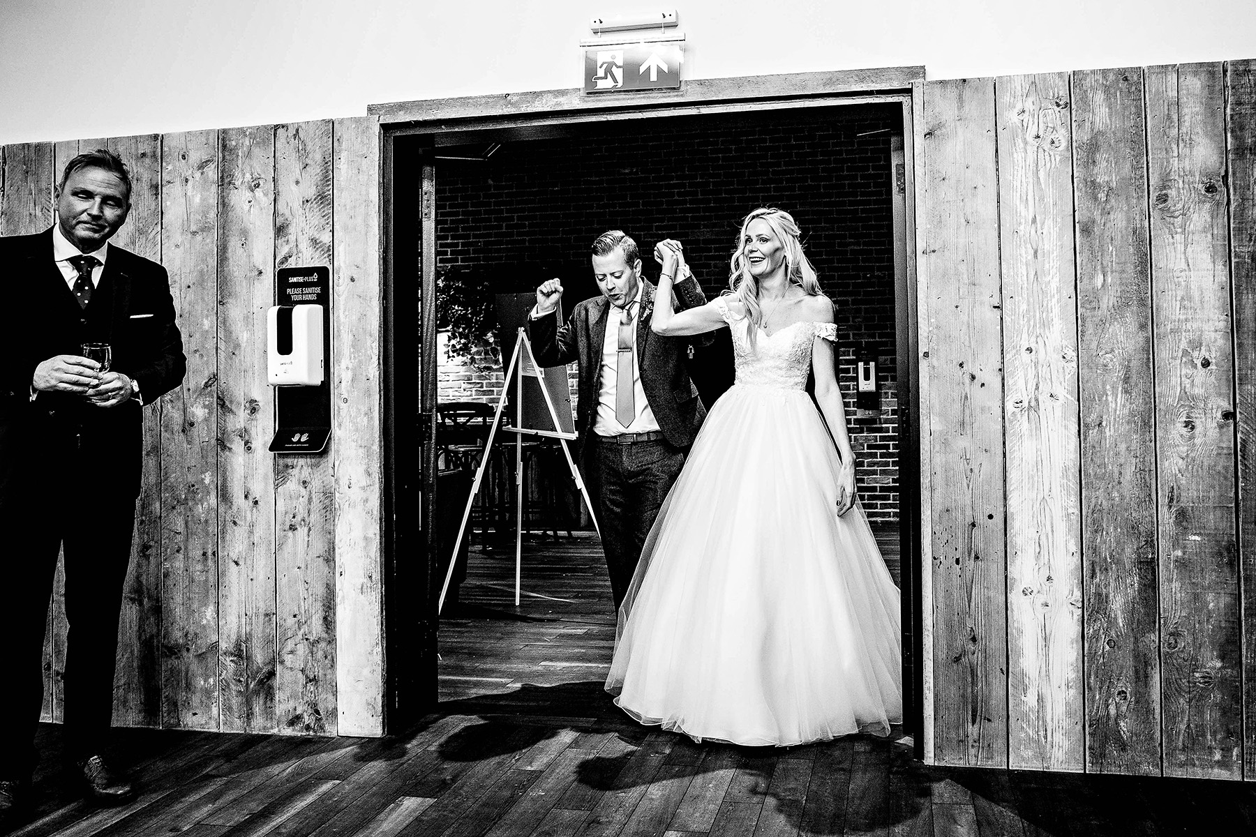 The bride and groom enter the barns