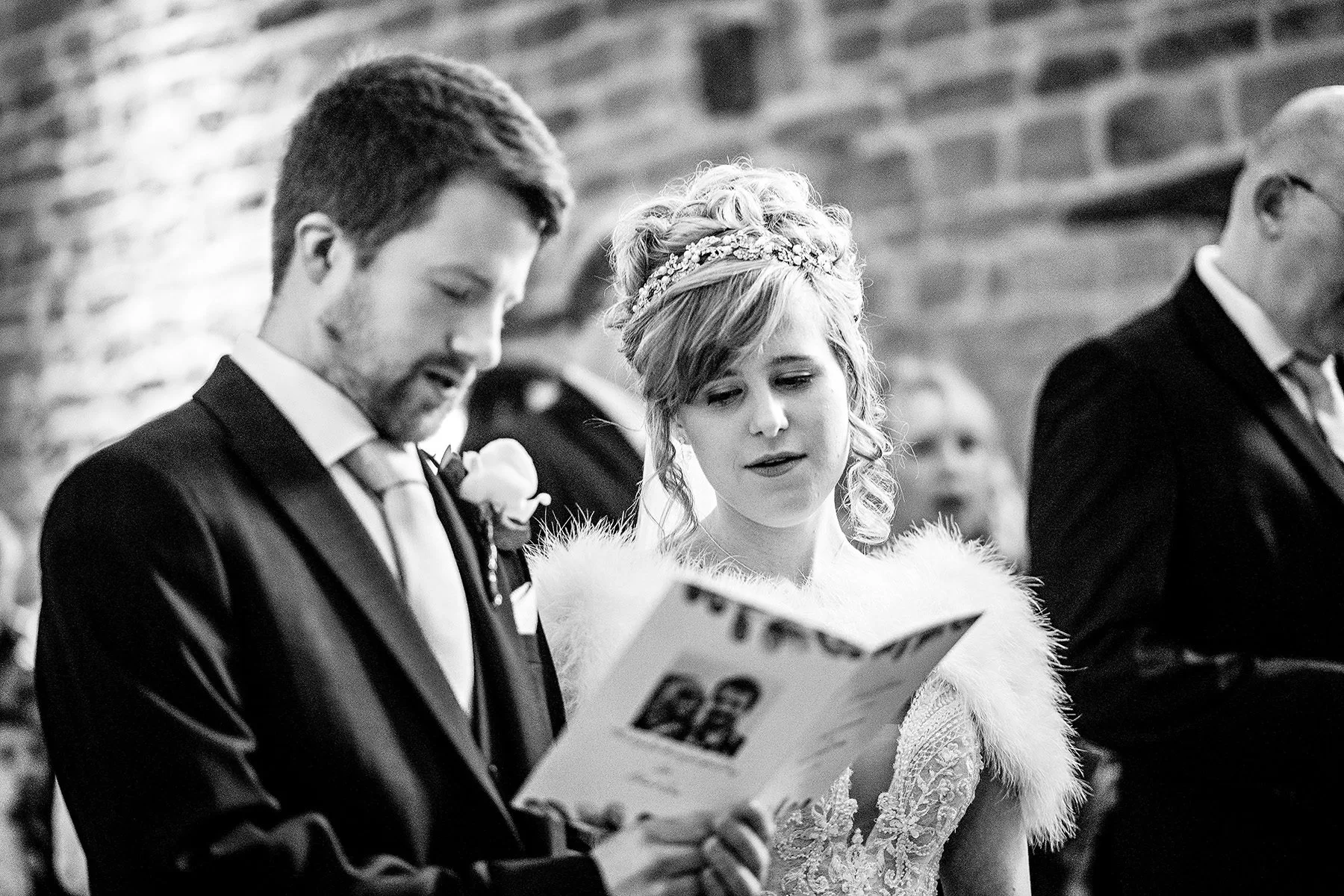 bride and groom reading